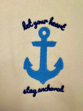 Blue anchor with 'Let your heart stay anchored' text on beige fabric