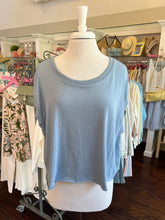Blue top on a mannequin in a clothing store