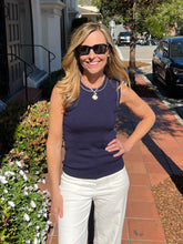 Navy crew neck sweater tank with a fitted look and white piping detail on the trim.