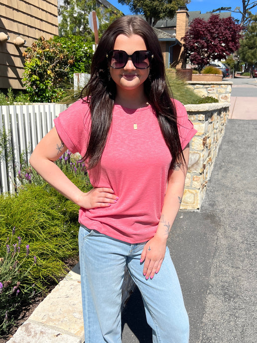 Coral ribbed short sleeve tee with 3 wood button details on the shoulders.