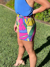 Women wearing colorful shorts, close up of side view.